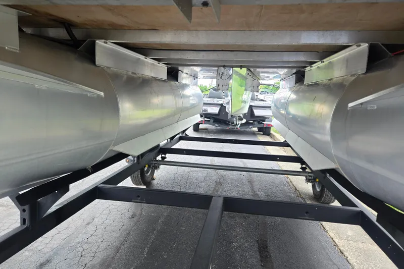 Slide: The Image of Underneath view of a 2021 Lexington 315 pontoon boat on a trailer. - 7