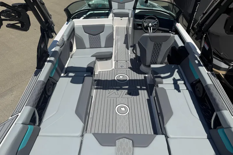 Slide: The Image of 2025 MasterCraft XT24 boat interior with sleek gray seating and modern design. - 15