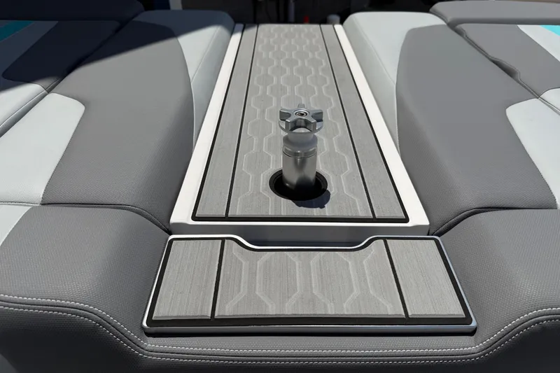 Slide: The Image of 2025 MasterCraft XT24 boat interior with sleek gray seating and modern design elements. - 16