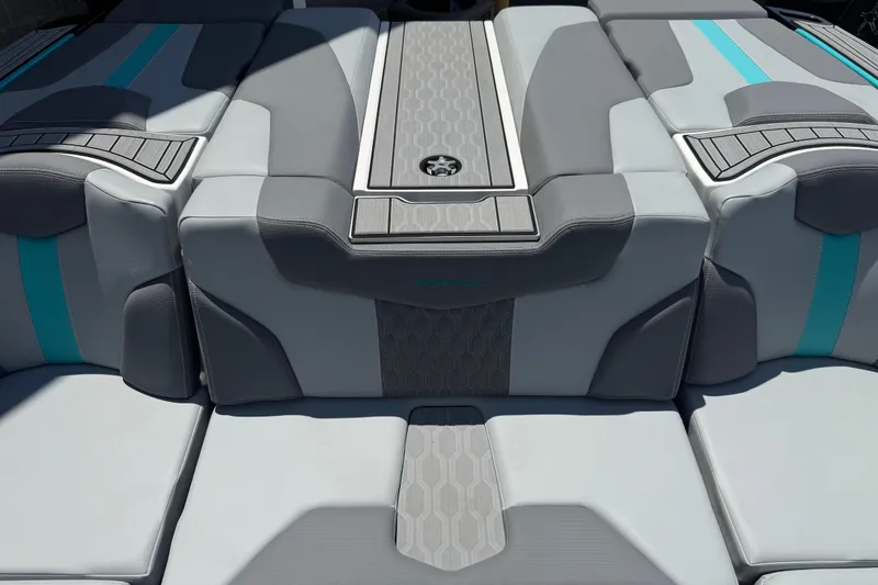 Slide: The Image of 2025 MasterCraft XT24 boat interior with gray and teal upholstery, featuring modern design elements. - 17