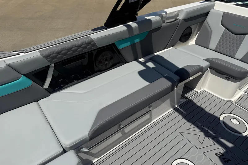 Slide: The Image of 2025 MasterCraft XT24 boat interior with sleek gray seating and modern design elements. - 4
