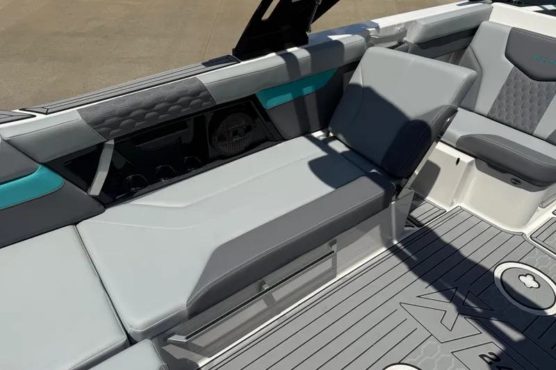 Slide: The Image of 2025 MasterCraft XT24 boat interior with sleek gray seating and modern design elements. - 9