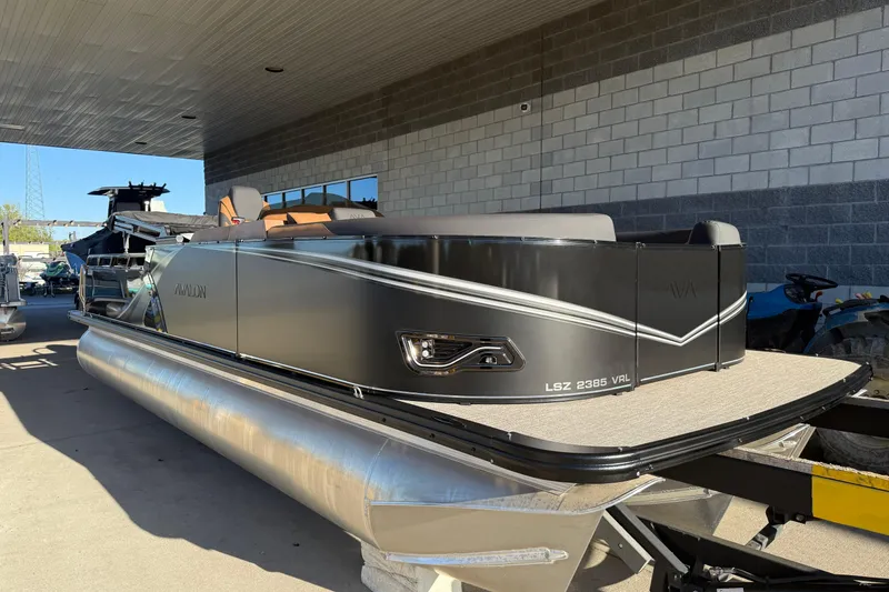 The Image of 2026 Avalon 2385 LSZ VRL pontoon boat displayed outdoors. - 0