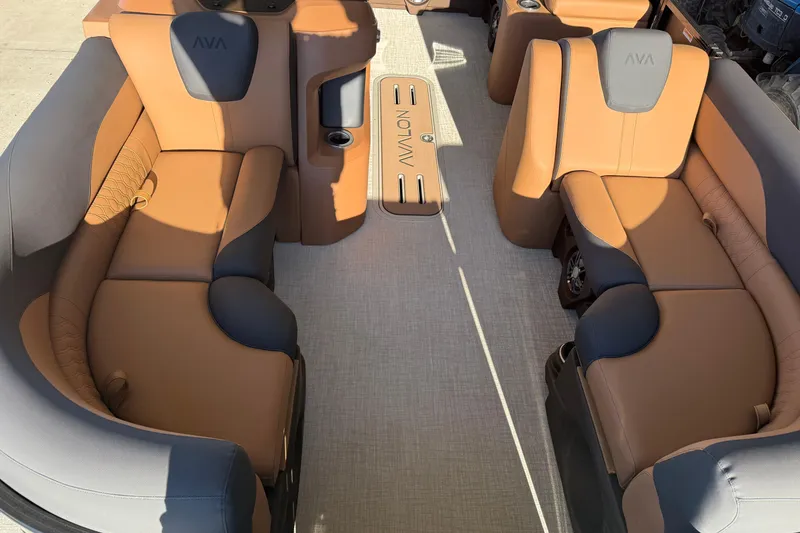 Slide: The Image of Luxurious interior of 2026 Avalon 2385 LSZ VRL pontoon boat with tan and gray seating. - 2