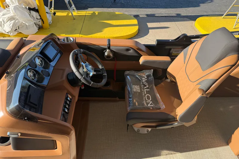 Slide: The Image of Interior of 2026 Avalon 2385 LSZ VRL boat with steering wheel and captain's chair. - 4