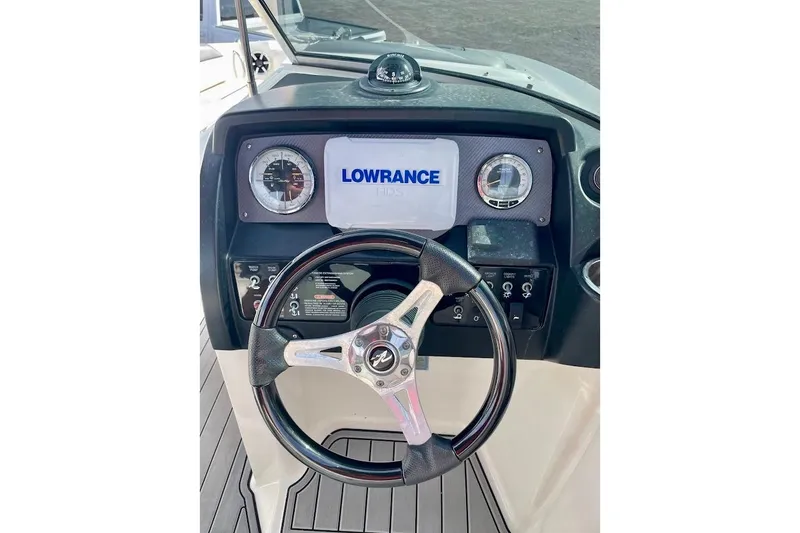 Slide: The Image of Steering console of 2010 Sea Ray 300 Sundeck with Lowrance display and gauges. - 11