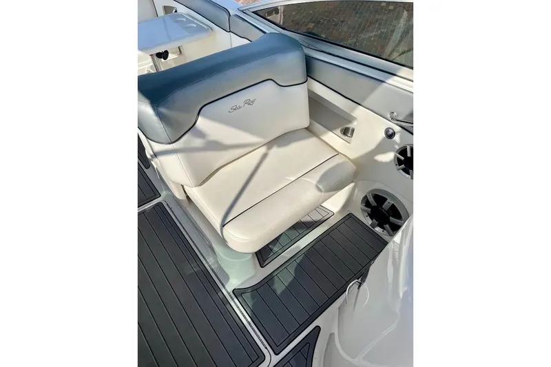 Slide: The Image of 2010 Sea Ray 300 Sundeck boat seat with white and blue upholstery. - 15