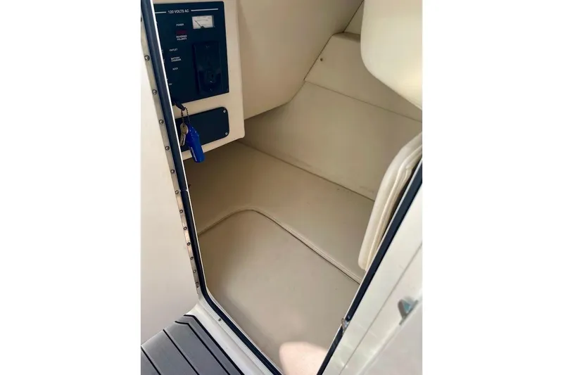 Slide: The Image of Interior cabin of 2010 Sea Ray 300 Sundeck boat with control panel. - 21