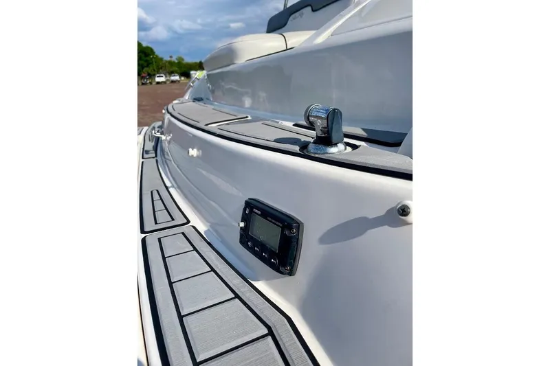Slide: The Image of 2010 Sea Ray 300 Sundeck boat deck with sleek design and modern fittings. - 24