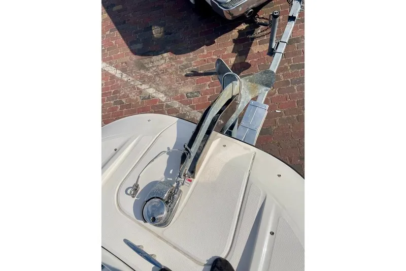 Slide: The Image of Bow view of 2010 Sea Ray 300 Sundeck with anchor on trailer. - 8