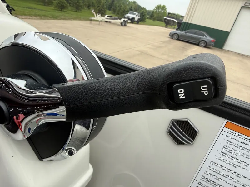 Slide: The Image of Close-up of a throttle lever on a 2017 South Bay 500 Series boat. - 16