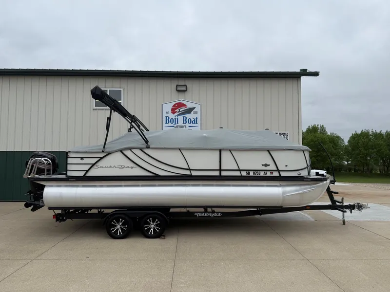 Slide: The Image of 2017 South Bay 500 Series pontoon boat in front of Boji Boat building. - 30