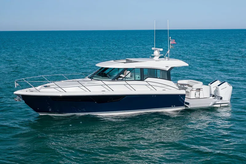 Slide: The Image of Manufacturer Provided Image: 2025 Tiara Yachts 43 LE cruising on open water under clear skies. - 1