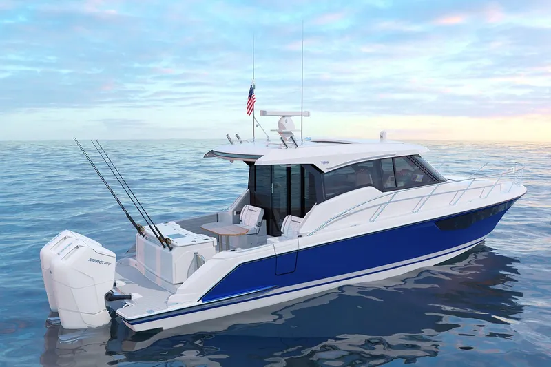 Slide: The Image of Manufacturer Provided Image: 2025 Tiara Yachts 43 LE boat on calm ocean, featuring sleek design and fishing rods. - 16