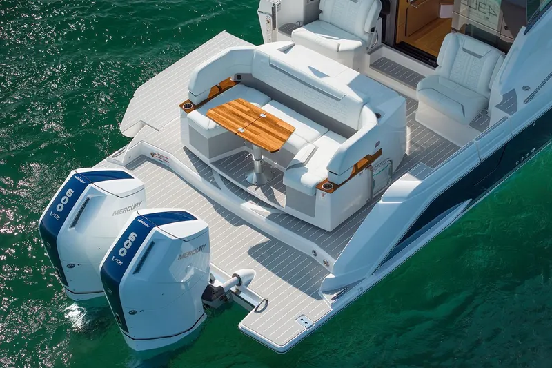 Slide: The Image of Manufacturer Provided Image: 2025 Tiara Yachts 43 LE with dual engines and luxurious seating on the water. - 6