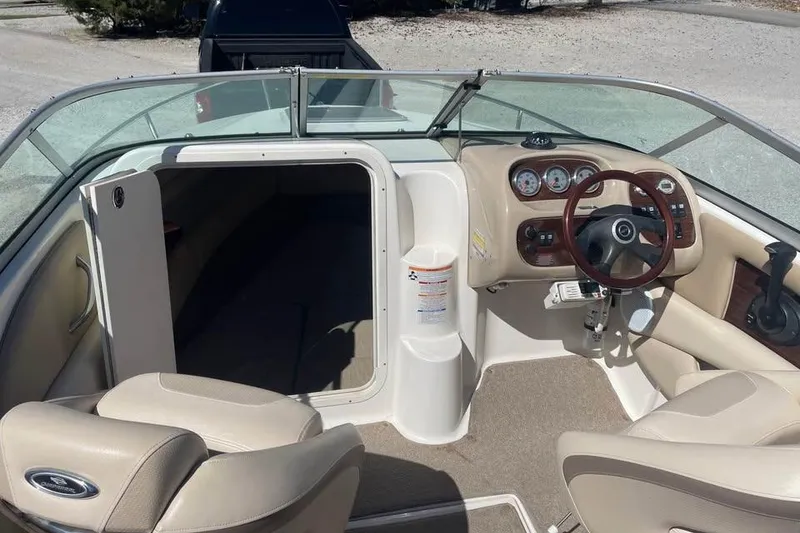 Slide: The Image of 2007 Chaparral 215 SSi boat interior with steering wheel and seating area. - 6
