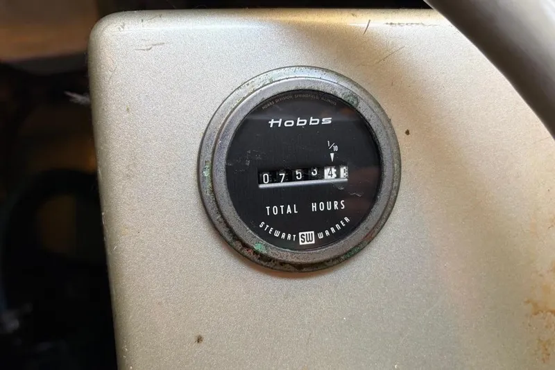 Slide: The Image of Hour meter on 1976 Grand Banks 32 Sedan showing 7534 total hours. - 12