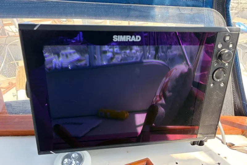 Slide: The Image of Simrad marine display on 1976 Grand Banks 32 Sedan boat dashboard. - 20