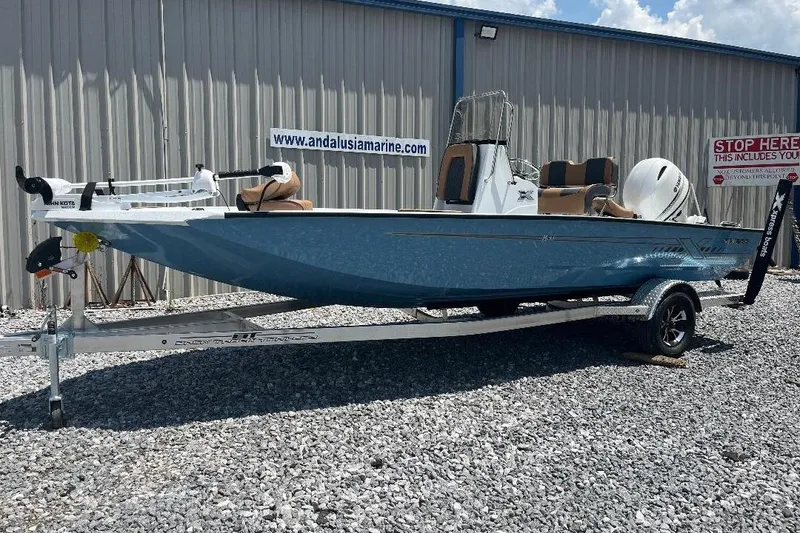 Slide: The Image of 2026 Xpress H20B Bay boat on trailer outside Andalusia Marine building. - 9