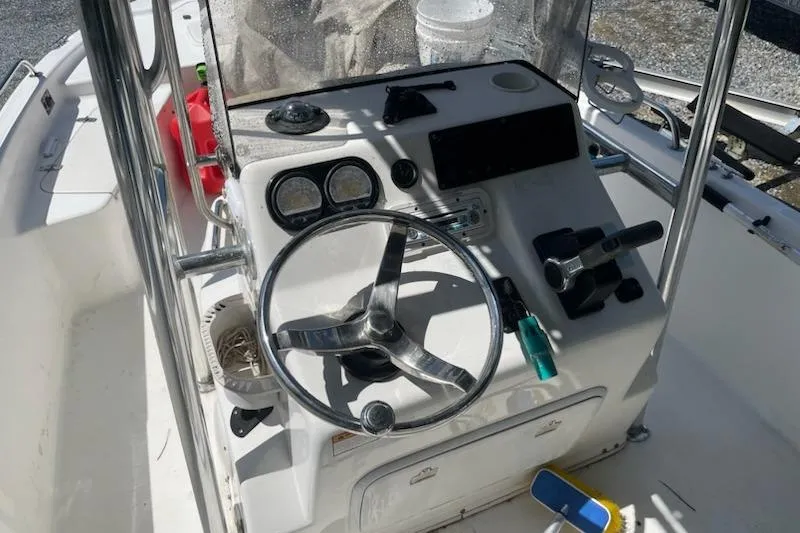 Slide: The Image of 2004 Century 1901 Bay Boat cockpit with steering wheel and controls. - 10