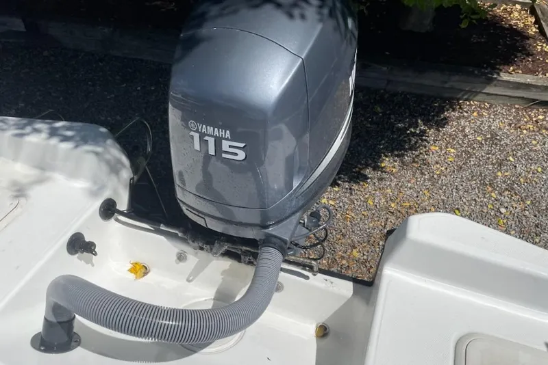 Slide: The Image of Outboard motor on 2004 Century 1901 Bay Boat, featuring Yamaha 115 engine. - 14