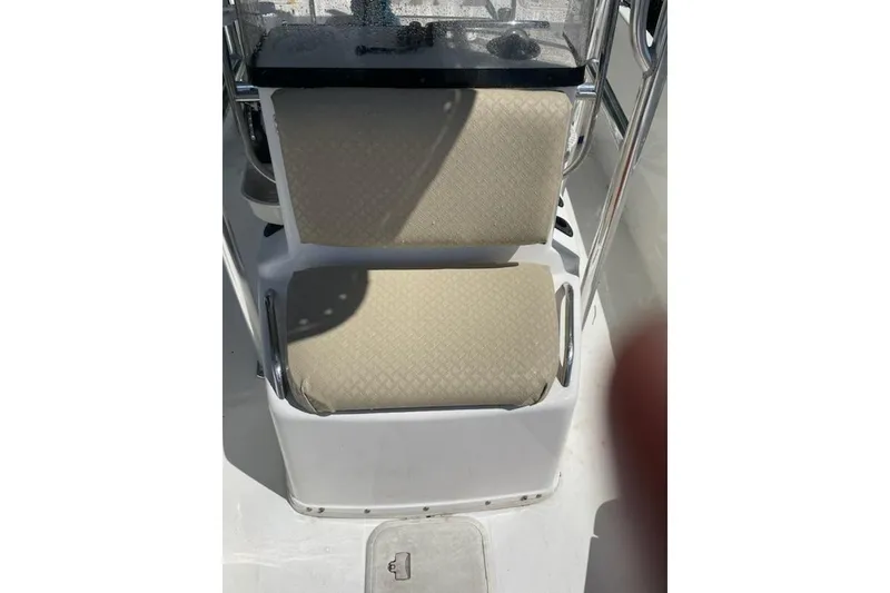 Slide: The Image of Century 1901 Bay Boat 2004 model with beige cushioned seating and stainless steel frame. - 8
