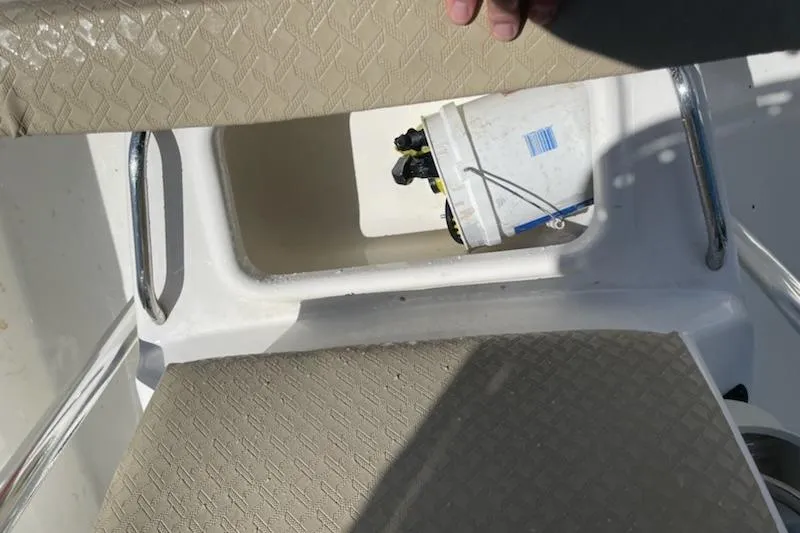 Slide: The Image of Century 1901 Bay Boat 2004 interior with storage compartment and bucket. - 9