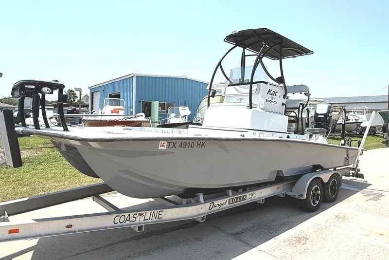 The Image of 2020 Dargel Kat 250 HDX boat on trailer, parked outdoors near blue building. - 0