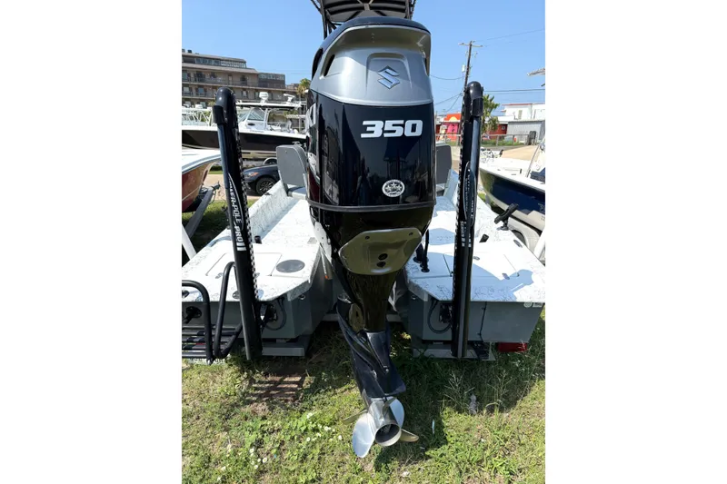 Slide: The Image of 2020 Dargel Kat 250 HDX boat with Suzuki 350 outboard motor, parked outdoors. - 15