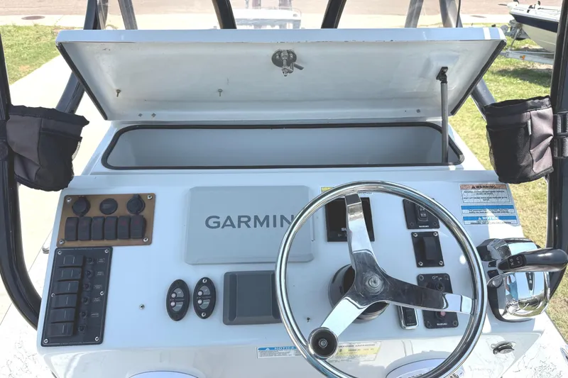 Slide: The Image of 2020 Dargel Kat 250 HDX boat console with Garmin navigation system and steering wheel. - 4