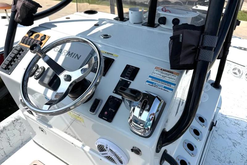 Slide: The Image of 2020 Dargel Kat 250 HDX boat console with Garmin navigation system and steering wheel. - 6