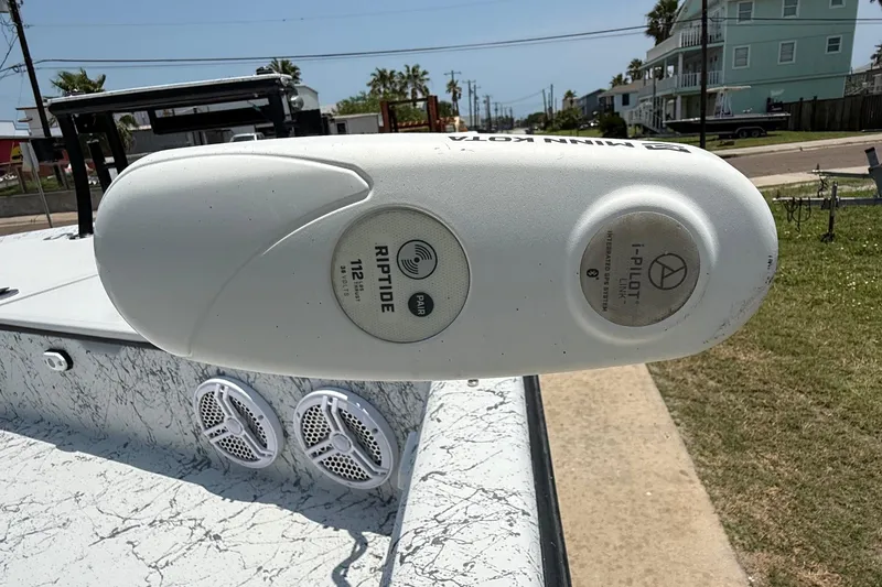 Slide: The Image of Minn Kota Riptide motor on 2020 Dargel Kat 250 HDX boat, parked outdoors. - 8