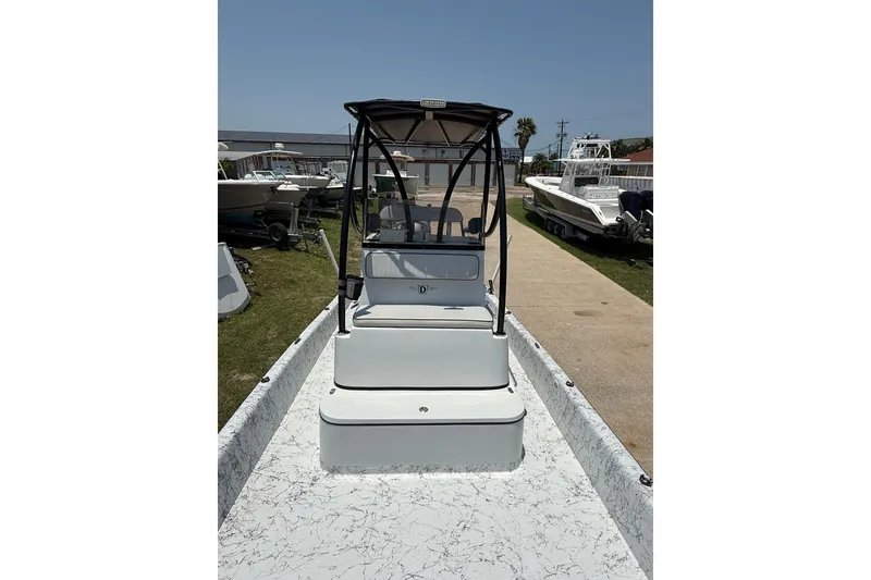 Slide: The Image of 2020 Dargel Kat 250 HDX boat with canopy, parked outdoors on a sunny day. - 9