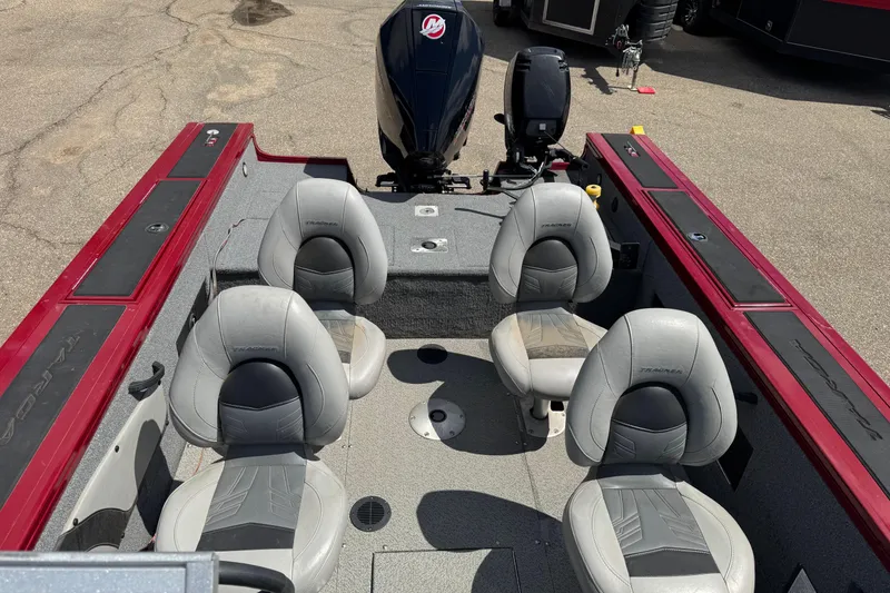 Slide: The Image of 2019 Tracker Targa V-18 WT boat interior with four seats and motor. - 11