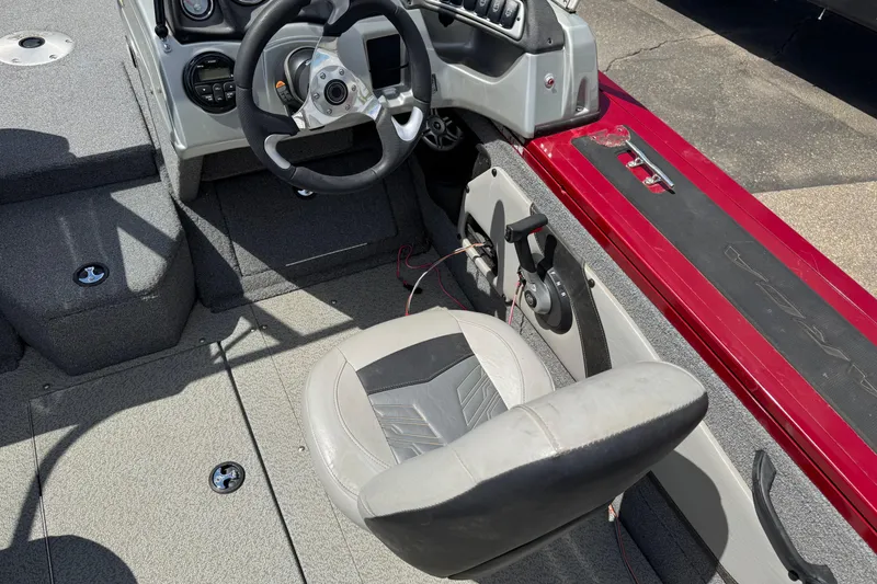 Slide: The Image of 2019 Tracker Targa V-18 WT boat interior with steering wheel and seat. - 6