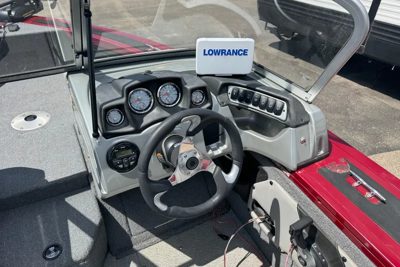 Slide: The Image of 2019 Tracker Targa V-18 WT boat dashboard with steering wheel and Lowrance GPS. - 7