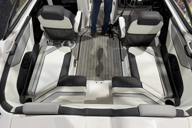 Slide: The Image of Interior of a 2021 Yamaha Boats 212S, featuring sleek seating and modern design. - 2