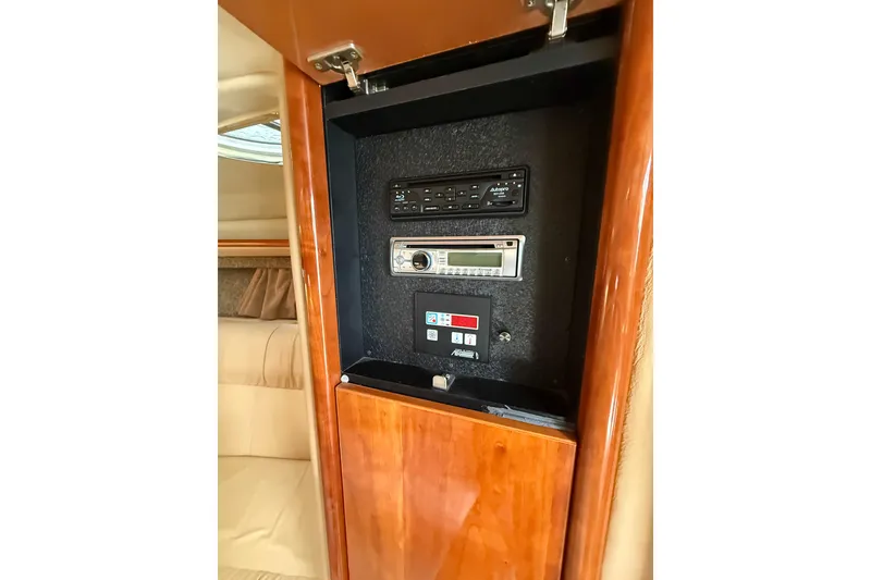 Slide: The Image of Control panel inside a 2004 Cobalt 360 boat, featuring audio and system controls. - 13