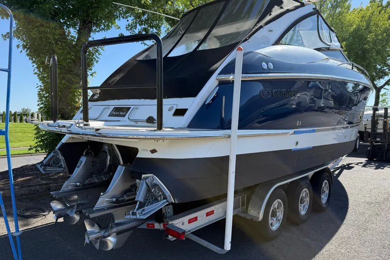 Slide: The Image of 2004 Cobalt 360 boat on trailer, featuring dual propellers and sleek design. - 19
