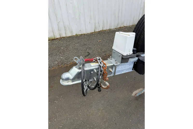 Slide: The Image of Trailer hitch of a 2004 Cobalt 360 with safety chains and lock. - 6