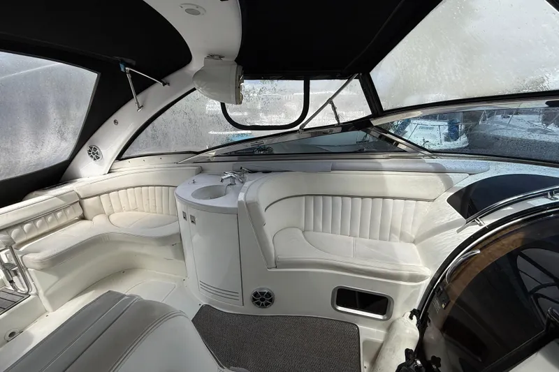 Slide: The Image of Luxurious interior of a 2004 Cobalt 360 boat with white seating and sleek design. - 9