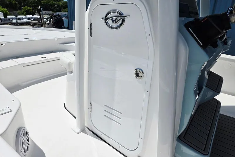 Slide: The Image of 2026 Tidewater 2210 Carolina Bay boat interior with sleek white console design. - 10