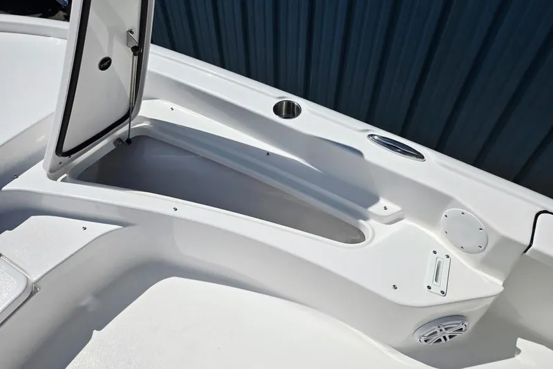 Slide: The Image of 2026 Tidewater 2210 Carolina Bay boat interior storage compartment with open hatch. - 11