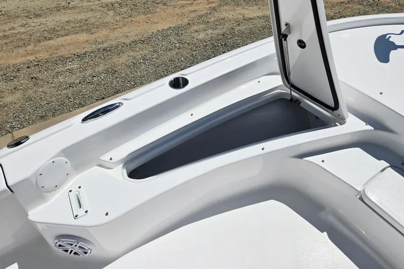 Slide: The Image of 2026 Tidewater 2210 Carolina Bay boat interior with open storage compartment. - 16
