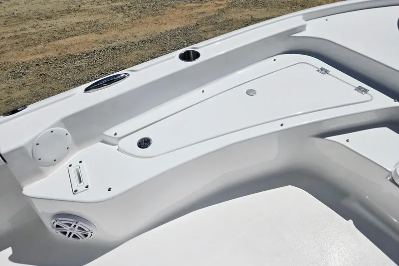 Slide: The Image of 2026 Tidewater 2210 Carolina Bay boat deck with storage compartments and speaker. - 17