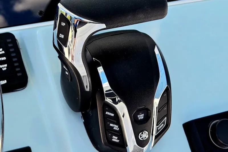 Slide: The Image of Close-up of 2026 Tidewater 2210 Carolina Bay boat throttle controls. - 20