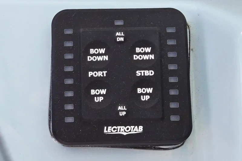 Slide: The Image of Control panel for 2026 Tidewater 2210 Carolina Bay boat with Lectrotab trim tab switches. - 22