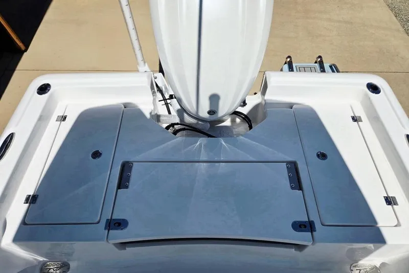 Slide: The Image of 2026 Tidewater 2210 Carolina Bay boat deck, featuring storage compartments and sleek design. - 33