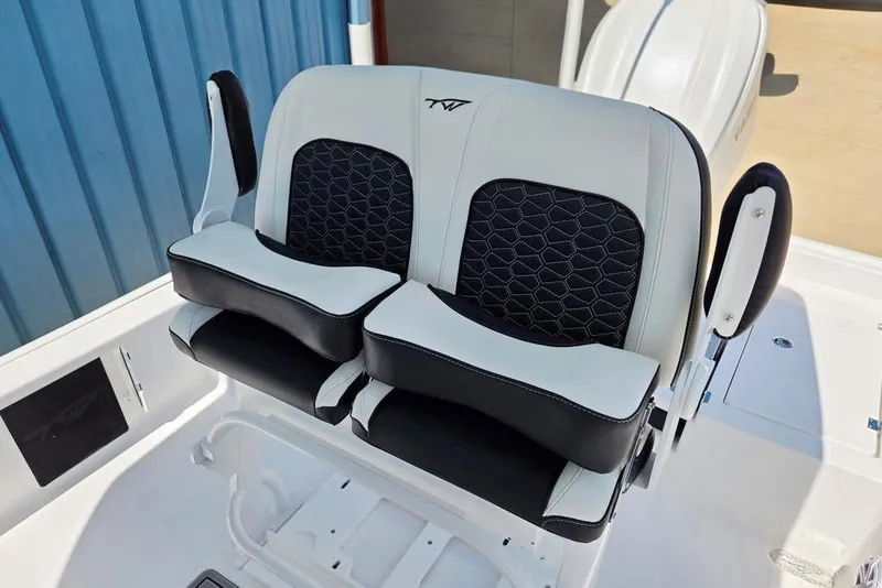 Slide: The Image of 2026 Tidewater 2210 Carolina Bay boat seating with black and white cushioned design. - 38