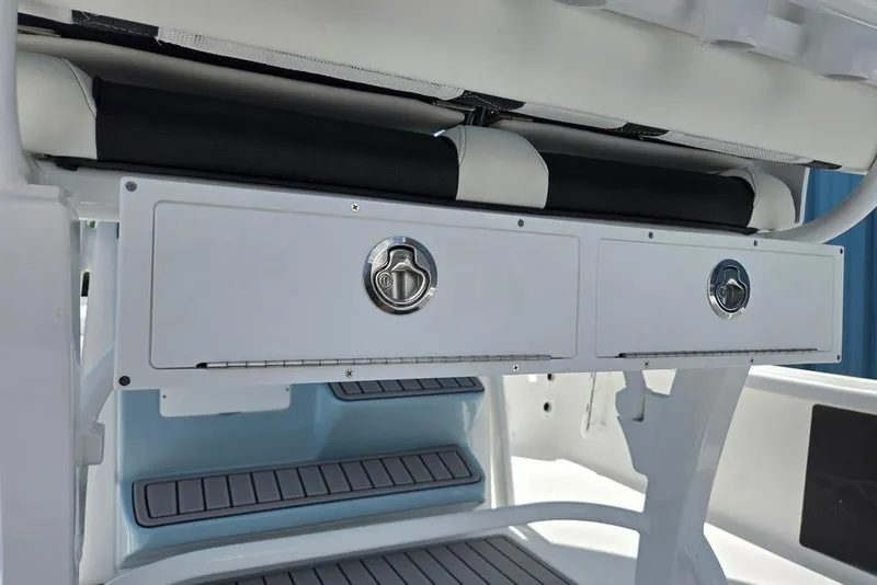 Slide: The Image of Storage compartments on a 2026 Tidewater 2210 Carolina Bay boat interior. - 43